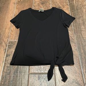 NWOT. Cute black top, ties at the bottom